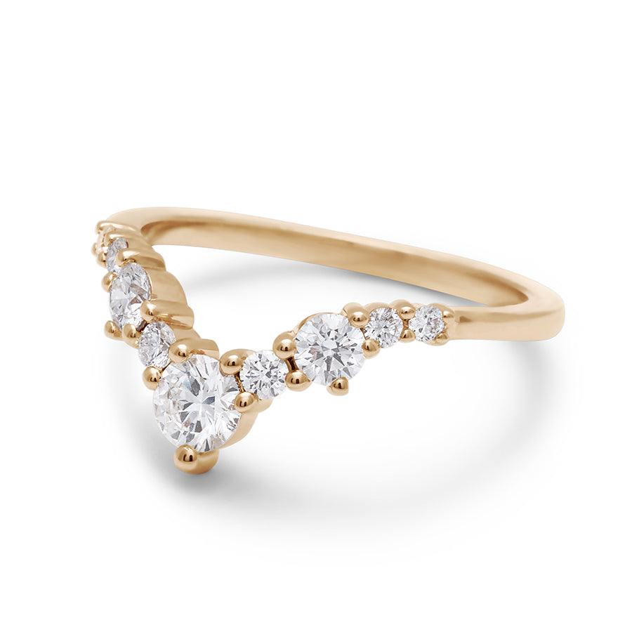 Angled view of a band with large white diamonds in ascending size set in yellow gold., Yellow Gold