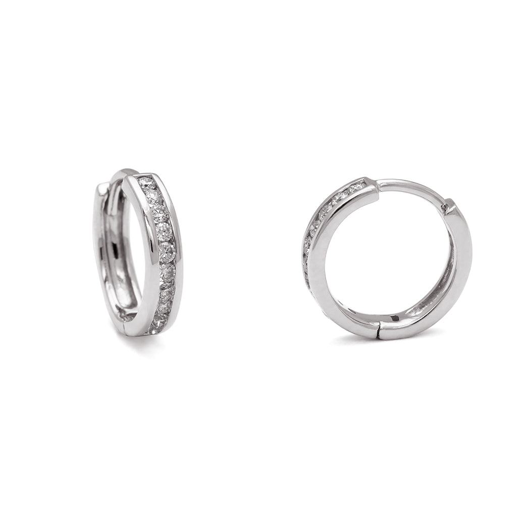 A pair of hoops with a line of grey diamonds set in sterling silver one earring angled.