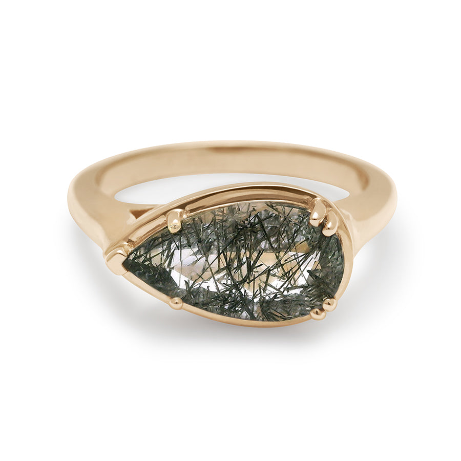 A solitaire ring pear shaped black rutilated quartz set in yellow gold.