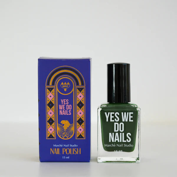 Green nail polish bottle and packaging with 'Yes We Do Nails' branding on a white background
