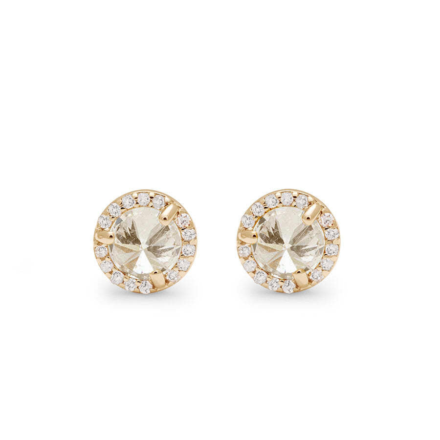 Front angle of two champagne diamond studs featuring a white diamond halo set in yellow gold against a white background. 