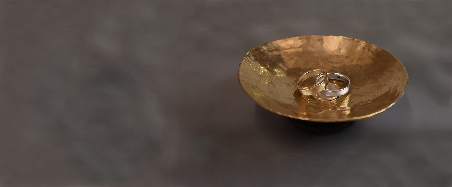 Men's and gender neutral wedding bands on anna sheffield's handmade objects dish