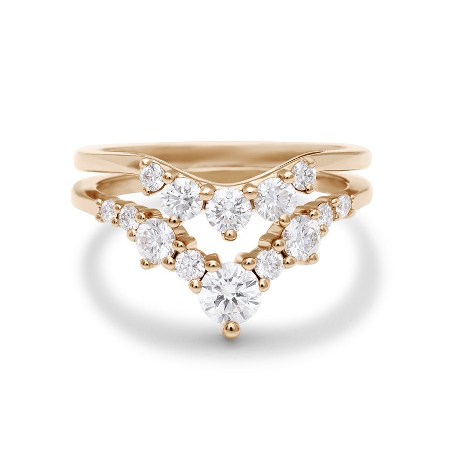 Two white diamond nesting bands set in yellow gold.