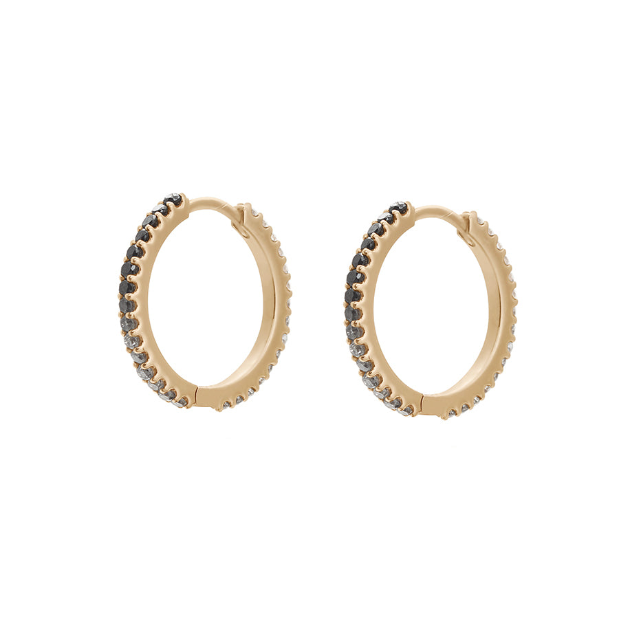 A pair of eternity hoops with ombre of black to grey to white diamonds set in yellow gold both earrings angled with no droplet.