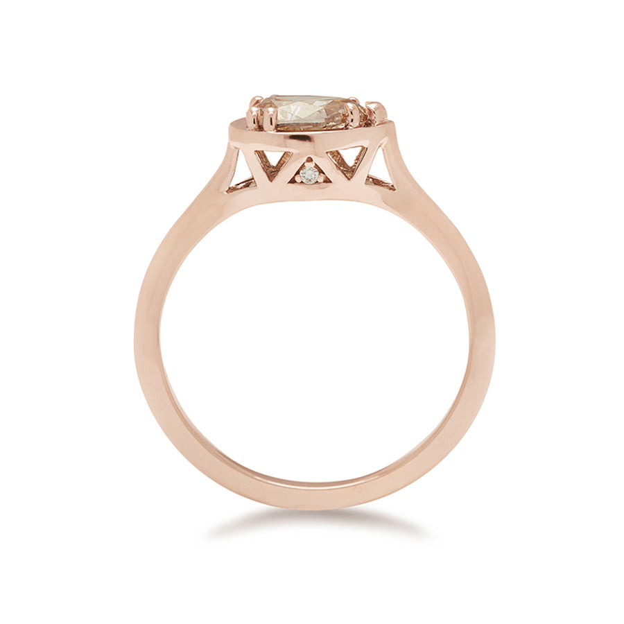 Side view of a pear shaped ring with a champagne diamond set in rose gold.