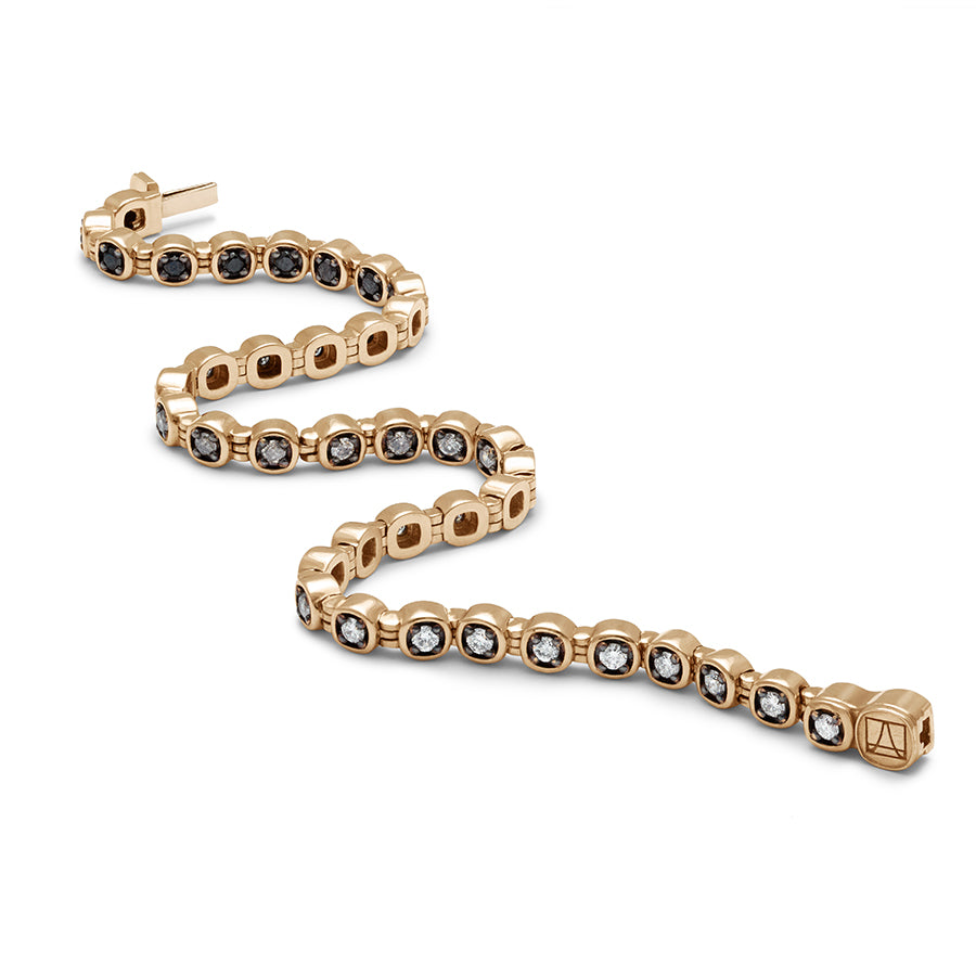 A zigzagged view of a line bracelet with grey, white and black diamonds set in eternity with rhodium set in yellow gold.
