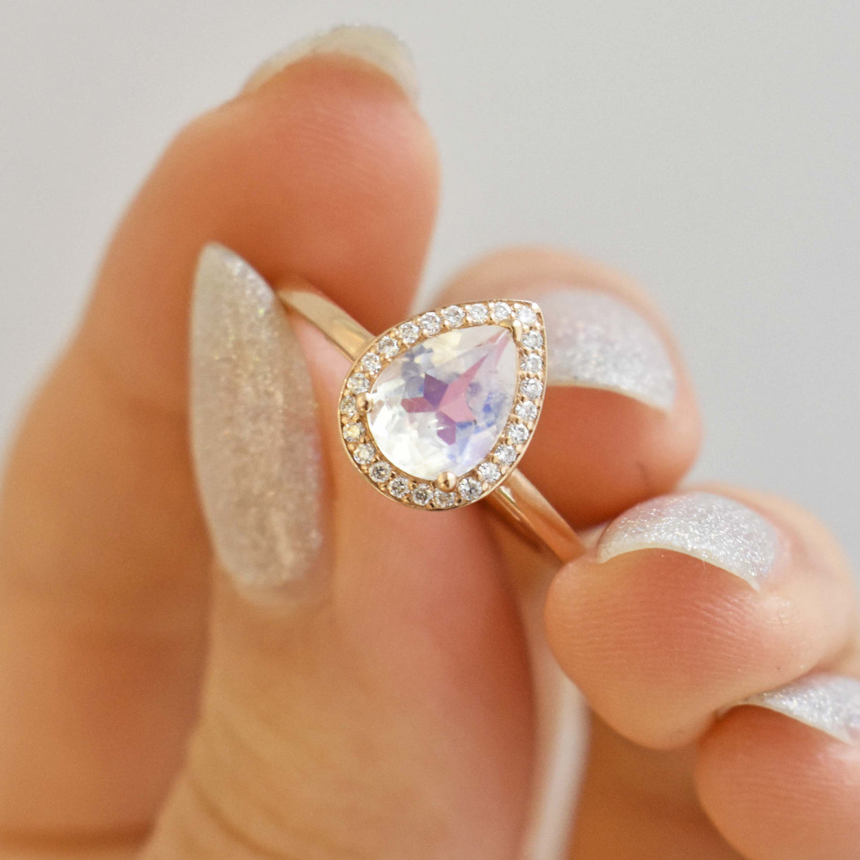 pear rosette ring with rainbow moonstone by Anna sheffield made in Yellow Gold, Rose Gold, or White Gold.