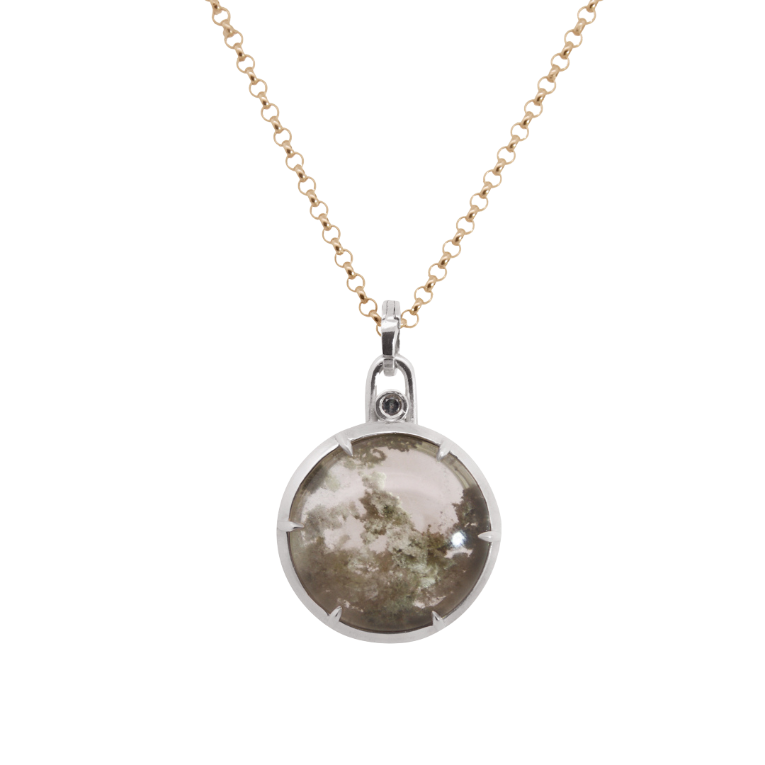 Yellow gold rolo chain necklace with a round grey garden quartz pendant set in silver on a white background 