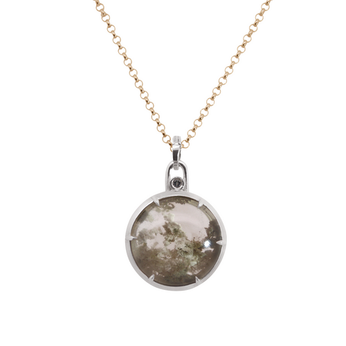 Yellow gold rolo chain necklace with a round grey garden quartz pendant set in silver on a white background 