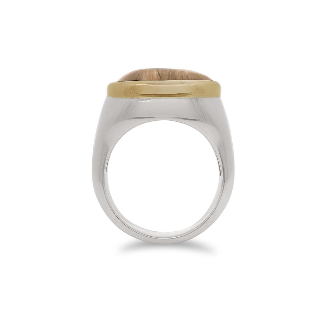Side profile of a terra firma cabochon quartz signet ring bezel set in a 14k yellow gold bezel and sterling silver shank. 