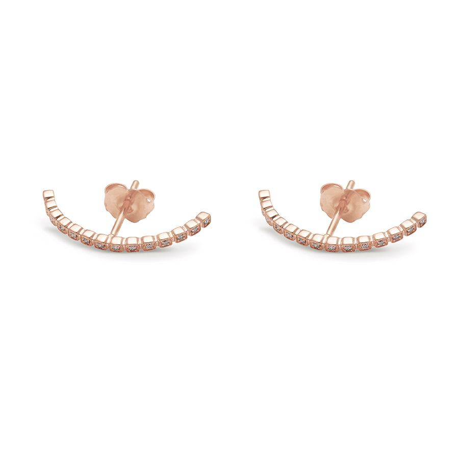 A pair of grey diamond dusted curve earrings set in rose gold both earrings on their side., Rose Gold