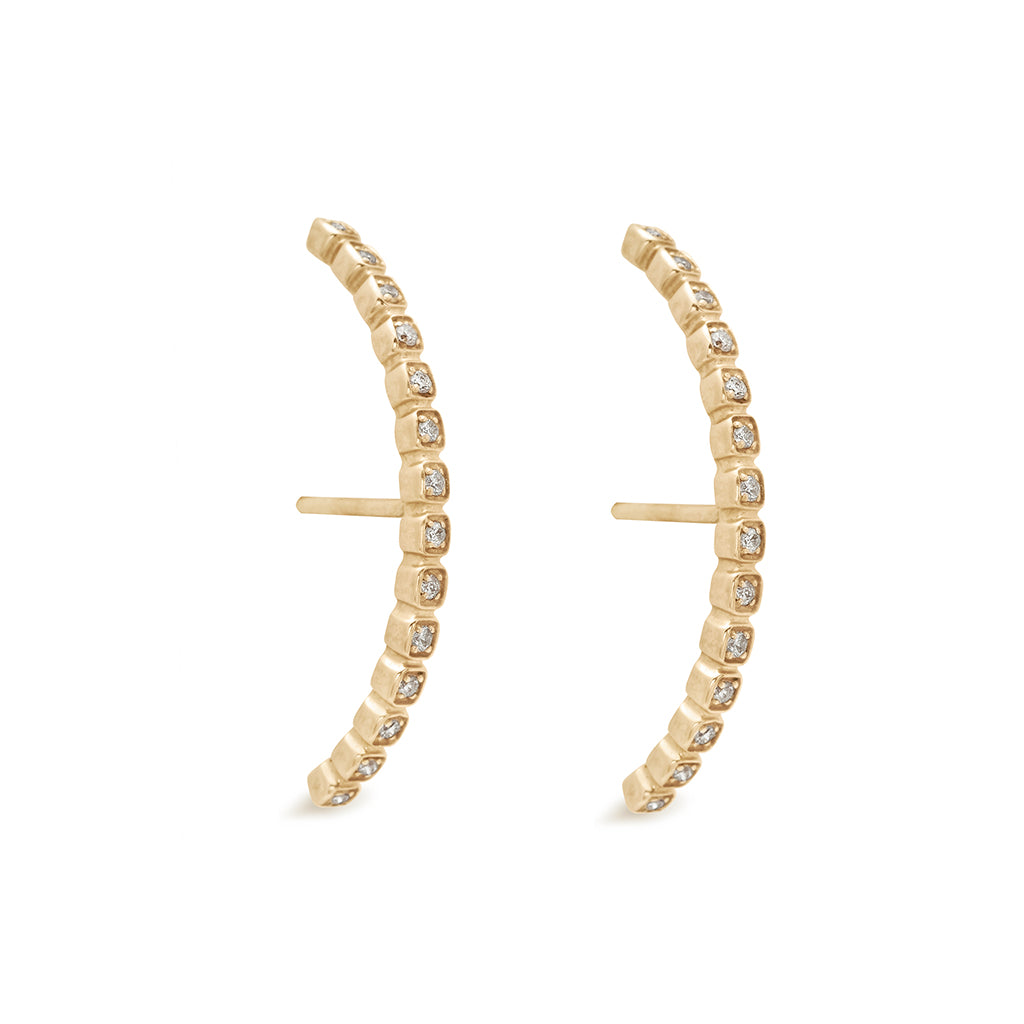 A pair of grey diamond dusted curve earrings set in yellow gold both earrings angled., Yellow Gold