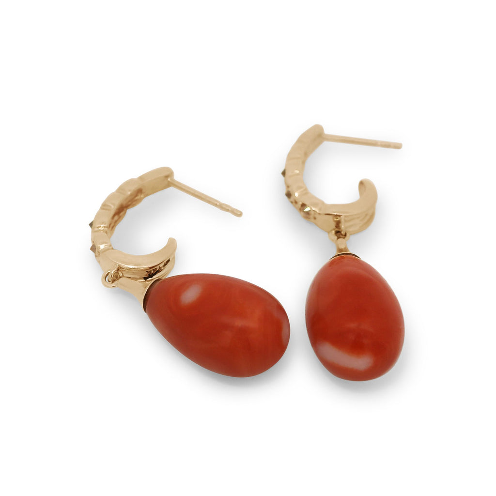 Coral drop earrings featuring champagne diamonds set in yellow gold.