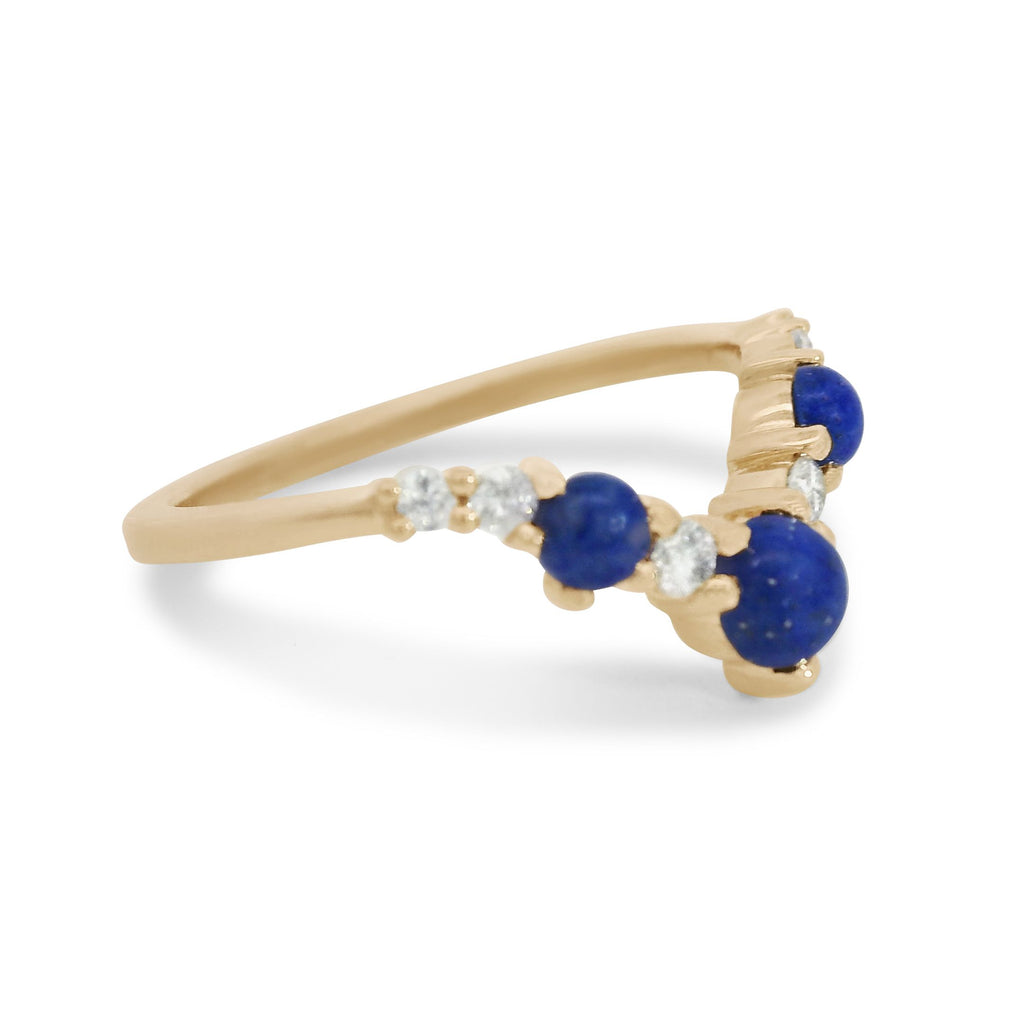 A lapis and white diamond band set in yellow gold. 