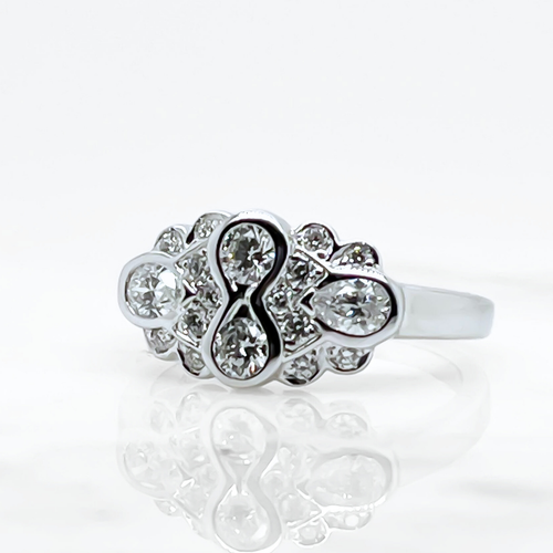 A multi diamond bezel ring set in white gold. 
