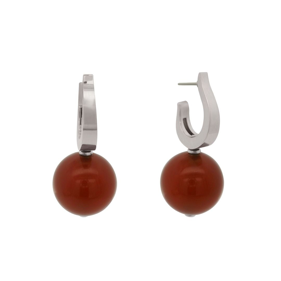 Pair of hoop earrings with round red gemstones on a white background