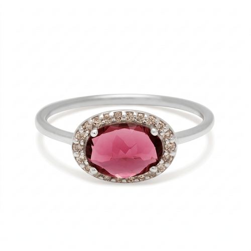 Silver ring with a pink gemstone on a white background