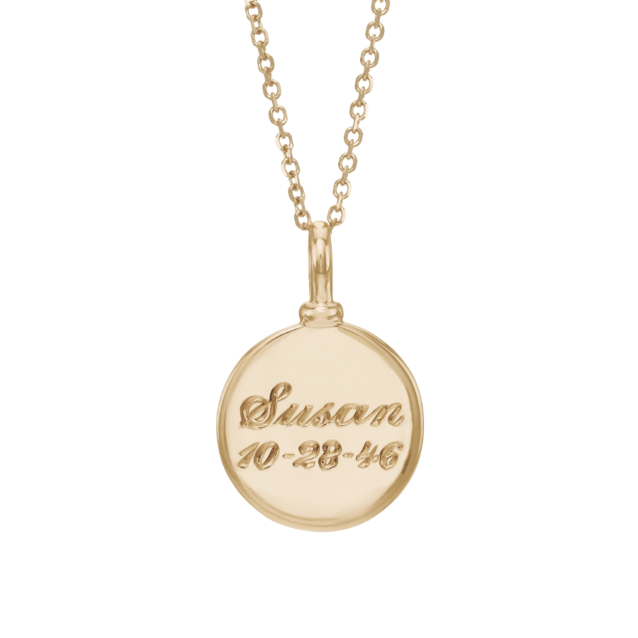A 14mm plain gold charm set in yellow gold on a yellow gold chain with "Susan 10-28-46" engraved on., 14mm