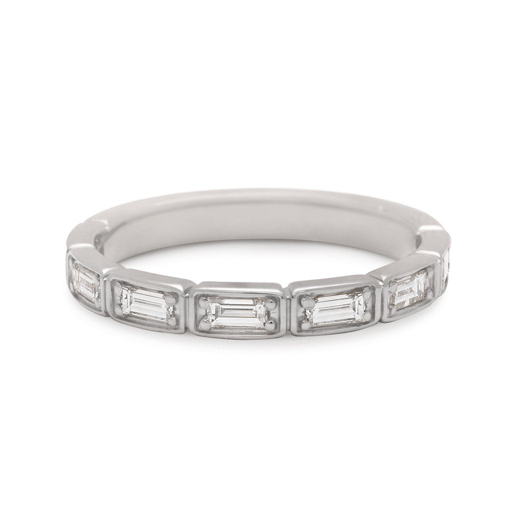 A white diamond baguette band that has diamond goes around 3/4 of the band set in white gold., White Gold