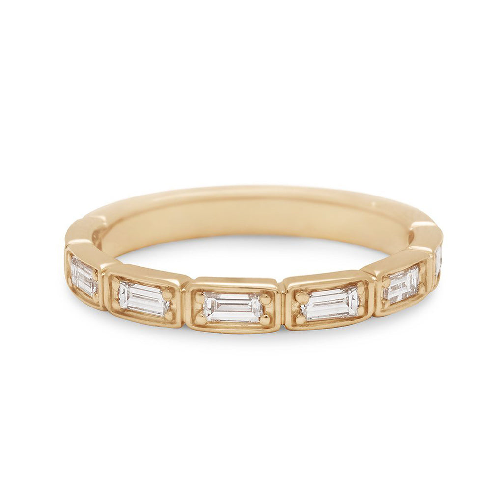 A white diamond baguette band that has diamond goes around 3/4 of the band set in yellow gold., Yellow Gold