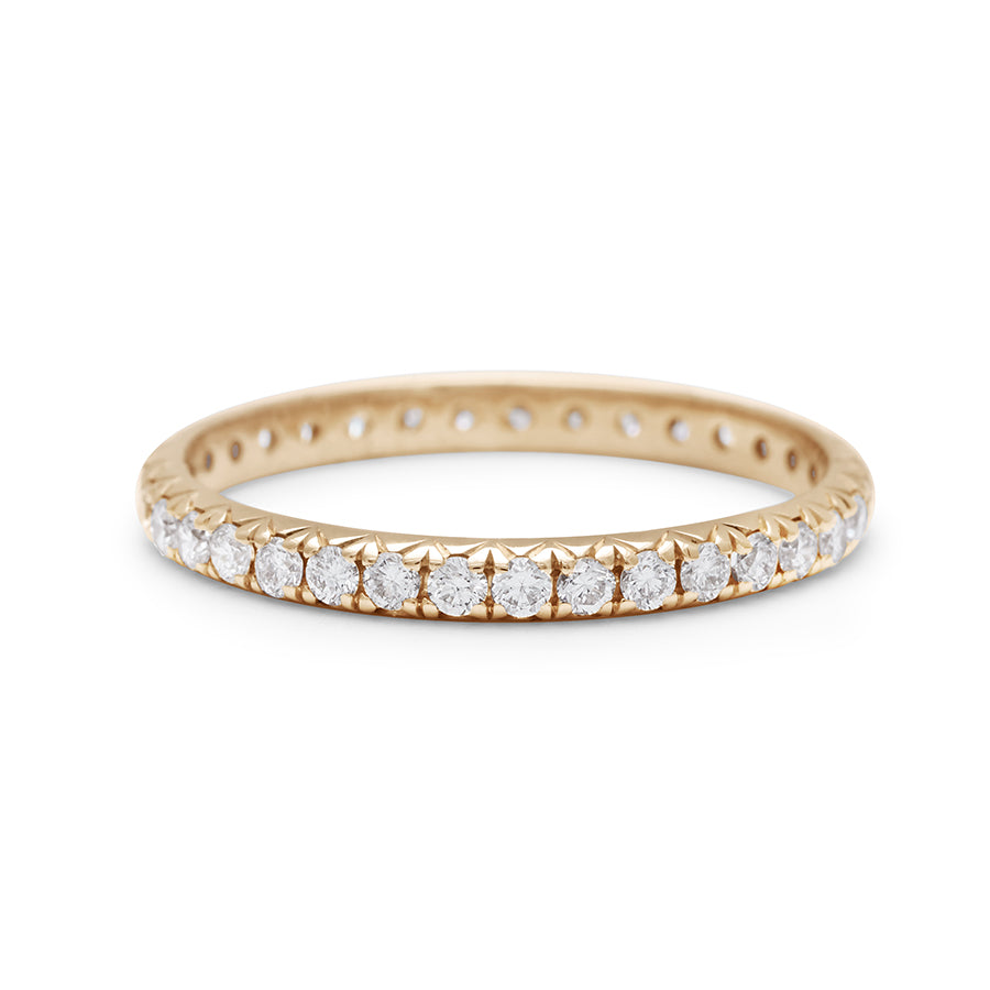 A yellow gold band with an eternity of round white diamond stones., Yellow Gold