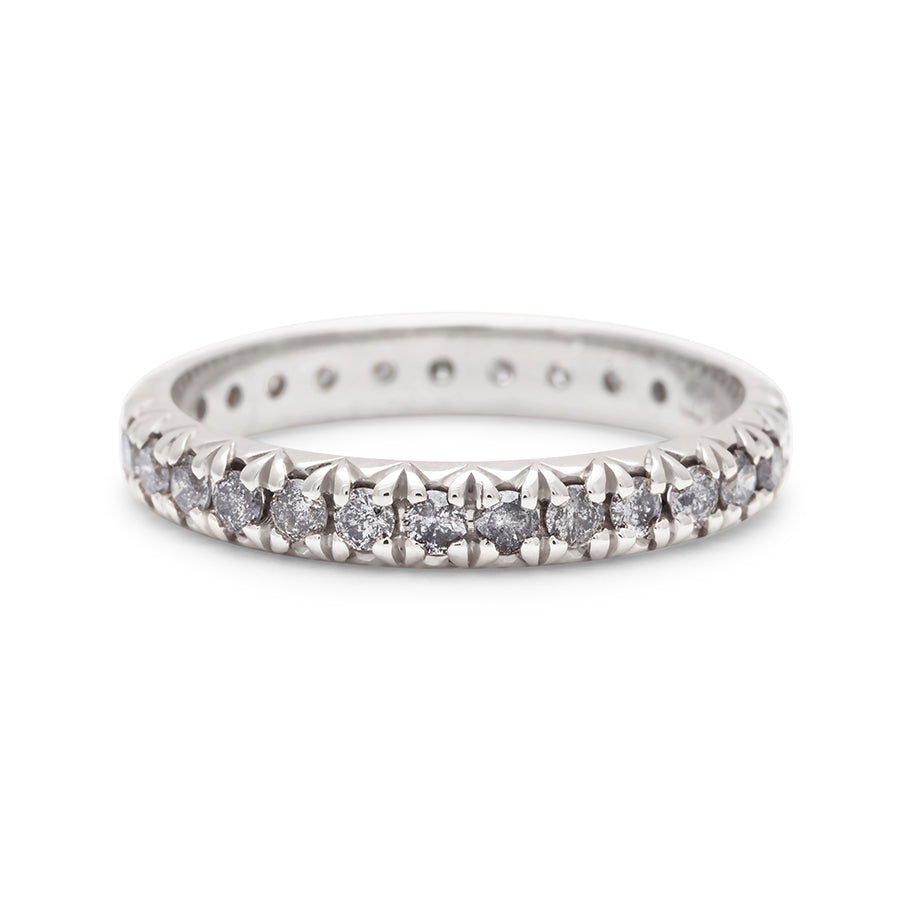 A white gold band with an eternity of round grey diamond stones., White Gold