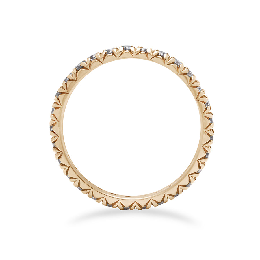 Side view of a yellow gold band with an eternity of round grey diamond stones.