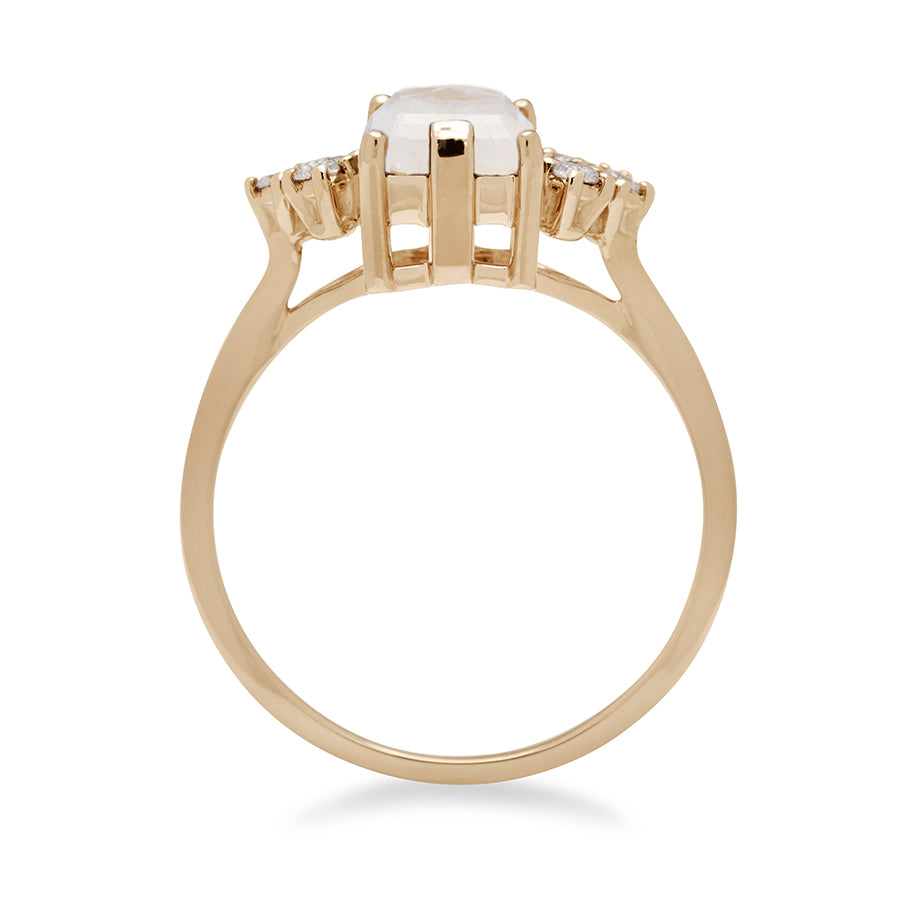 Side view of a ring with an emerald cut rainbow moonstone center with three round white diamonds on either side in arrow shape, set in yellow gold., Yellow Gold