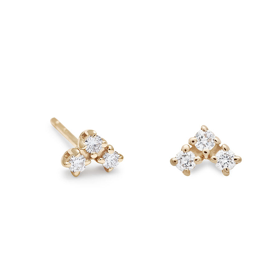 A pair of earrings with three white diamonds set in the shape of an arrow set in yellow gold on earring angled., Yellow Gold