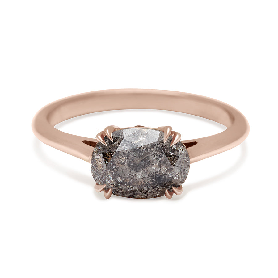 An east/west solitaire ring with an oval grey diamond stone set in rose gold., Rose Gold