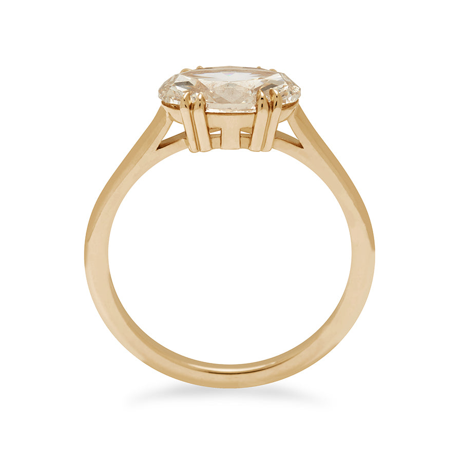 Side view of an east/west solitaire ring with an oval shape brilliant cut champagne diamond stone set in yellow gold.