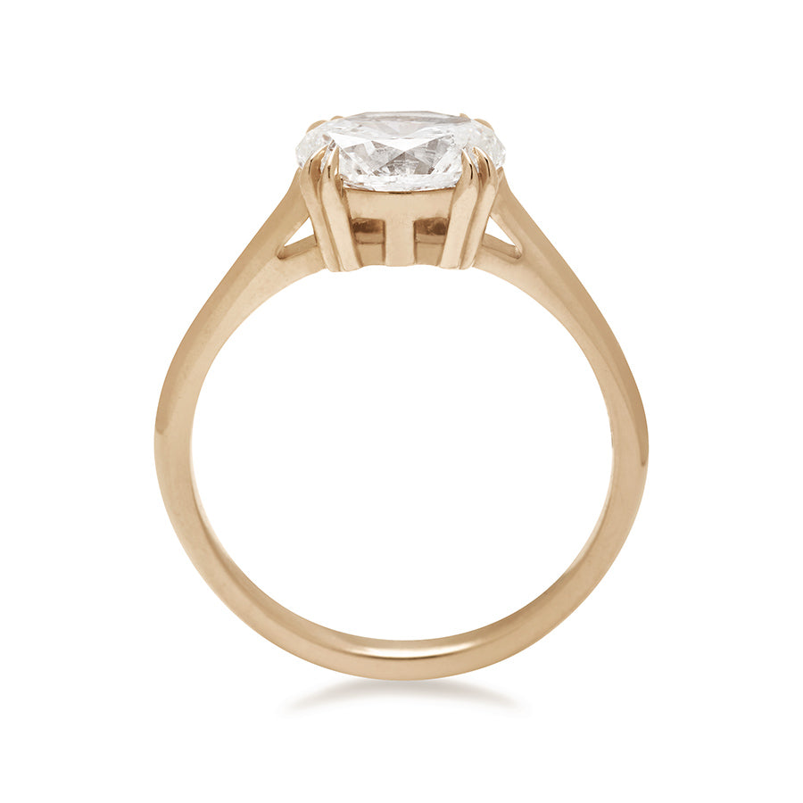 A side view of an east/west solitaire ring with an oval brilliant cut white diamond stone set in yellow gold., Yellow Gold