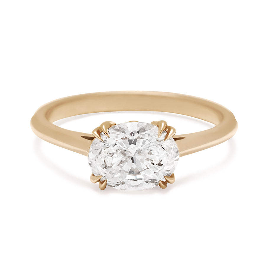 An east/west solitaire ring with an oval brilliant cut white diamond stone set in yellow gold., Yellow Gold