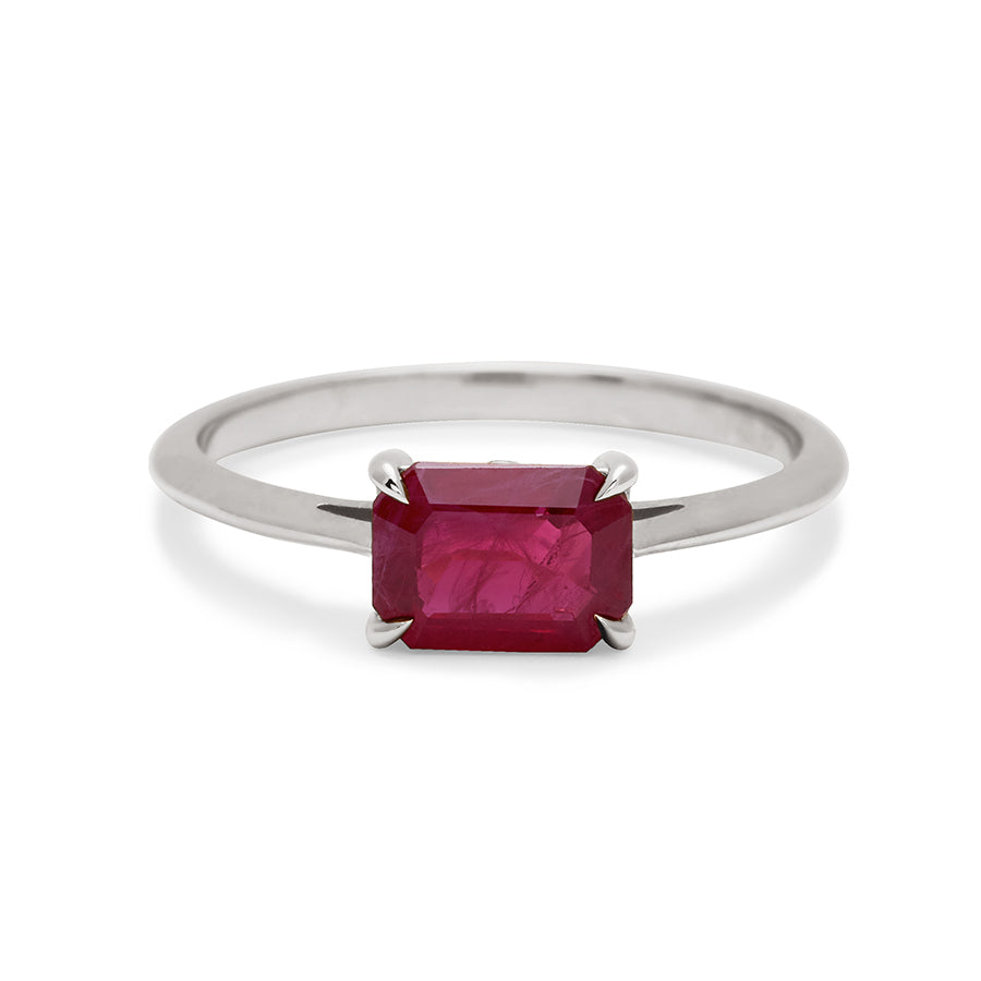 An east/west solitaire ring with an emerald shape ruby stone set in white gold., White Gold