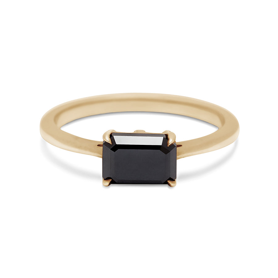 An east/west solitaire ring with an emerald shape black diamond stone set in yellow gold., Yellow Gold