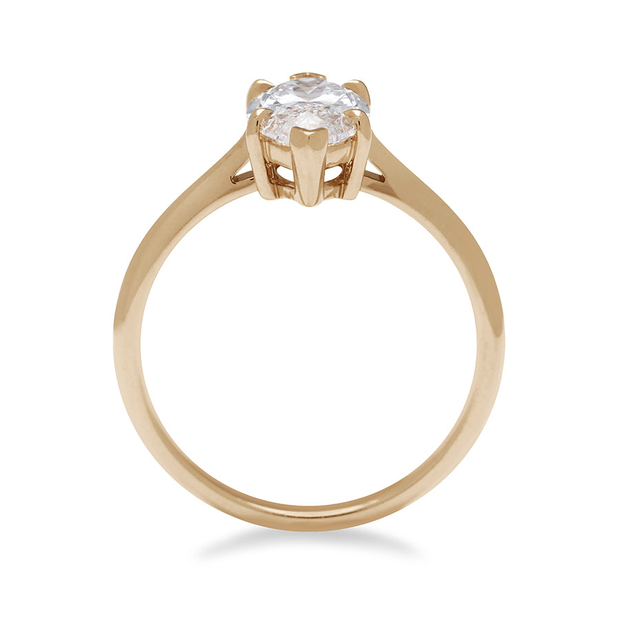 Side view of a solitaire ring marquise white diamond set in yellow gold., Yellow Gold
