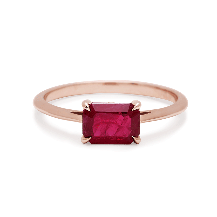An east/west solitaire ring with an emerald shape ruby stone set in rose gold., Rose Gold