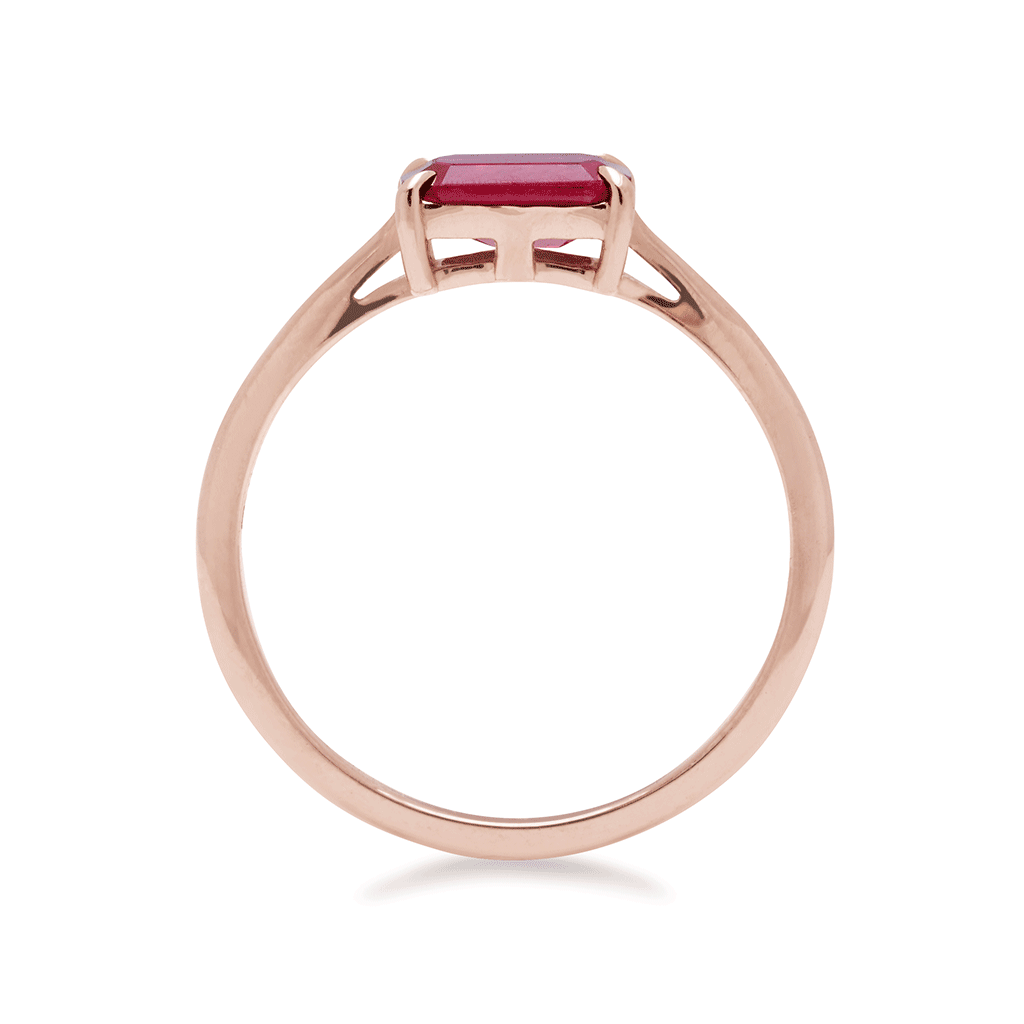 Side view of an east/west solitaire ring with an emerald shape ruby stone set in rose gold., Rose Gold