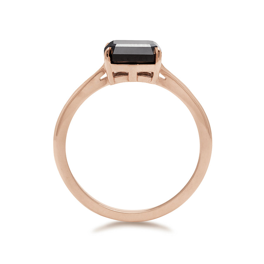 Side view of an east/west solitaire ring with an emerald shape black diamond stone set in rose gold., Rose Gold
