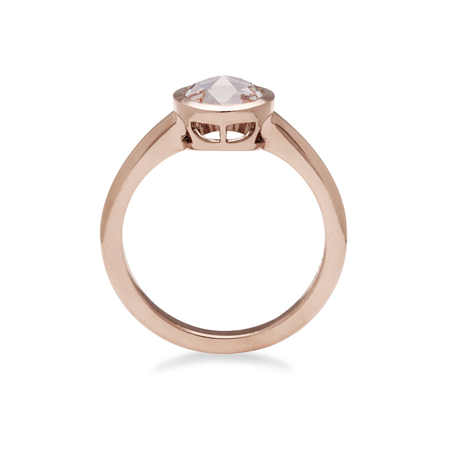 Side view of a round rose cut bezel set champagne diamond set in rose gold.