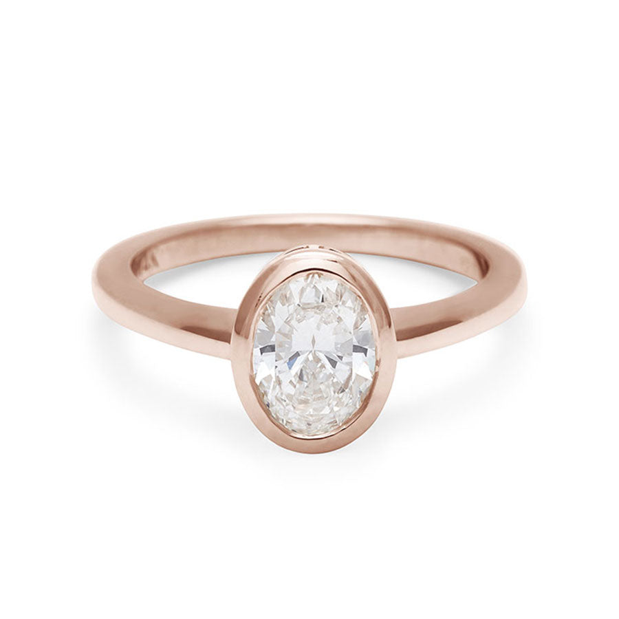 An oval brilliant cut bezel set lab white diamond set in rose gold., Rose Gold
