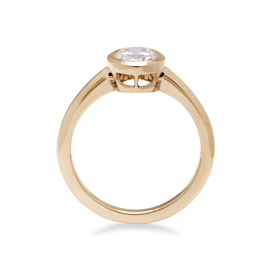 Side view of an oval brilliant cut bezel set lab white diamond set in yellow gold., Yellow Gold