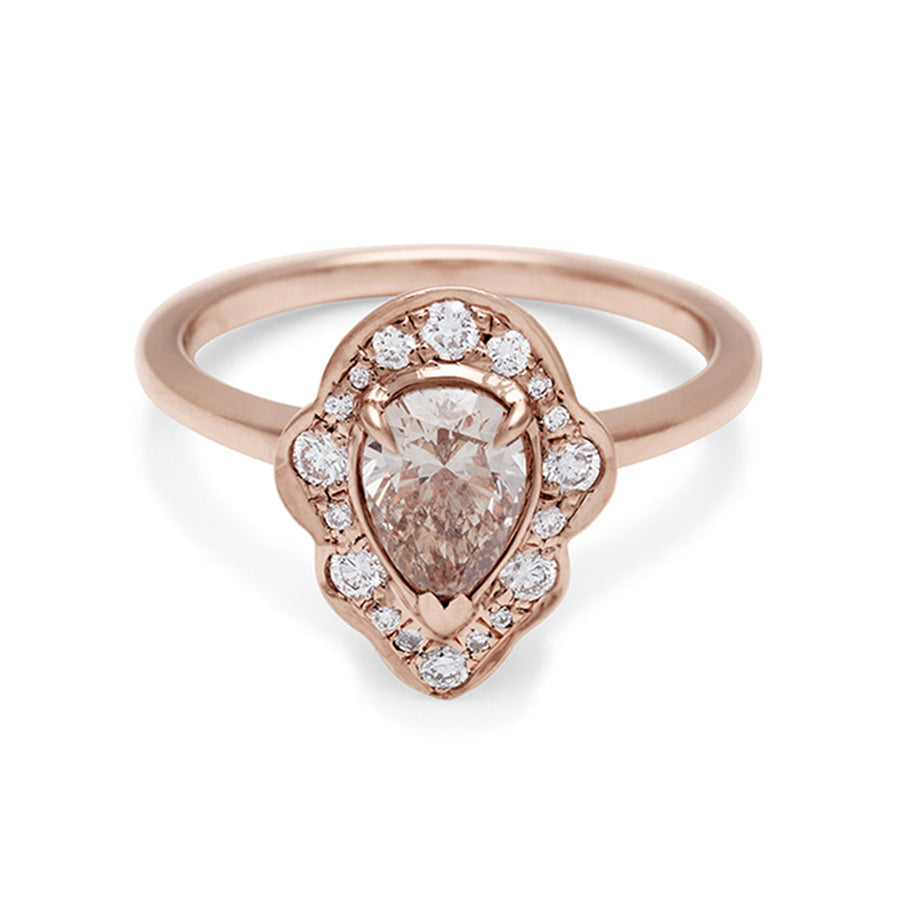A pear shaped champagne diamond ring set in a halo of white diamonds and in rose gold., Rose Gold