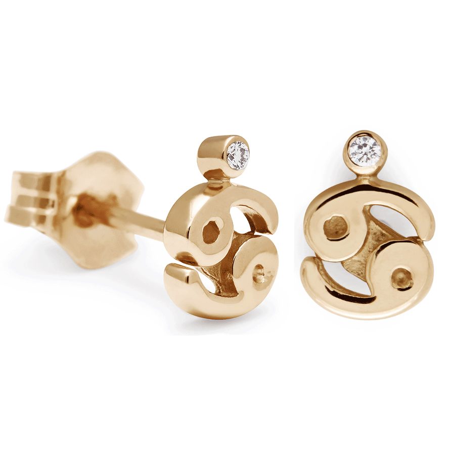 A pair of Cancer stud earrings set in yellow gold with a white diamond accent stone with one earring angled.