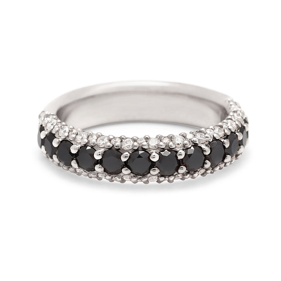 A band with round black diamonds in a 3/4 pave around a white gold band with white diamond accents on both top and bottom., White Gold