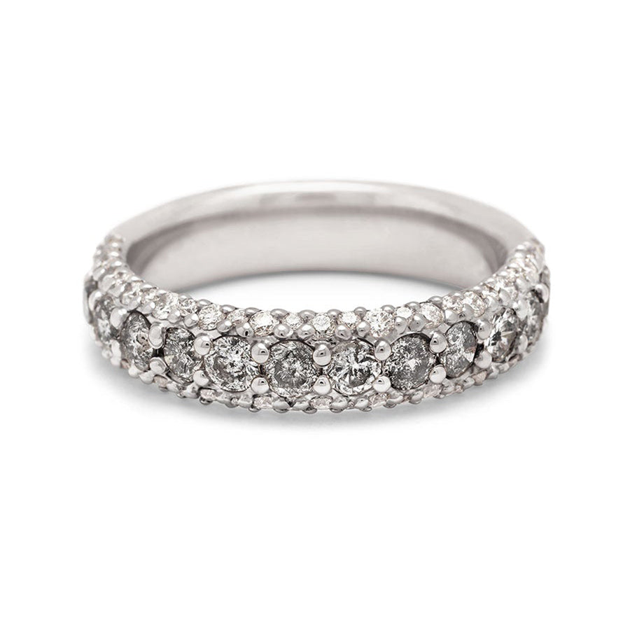 A band with round grey diamonds in a 3/4 pave around a white gold band with white diamond accents on both top and bottom., White Gold