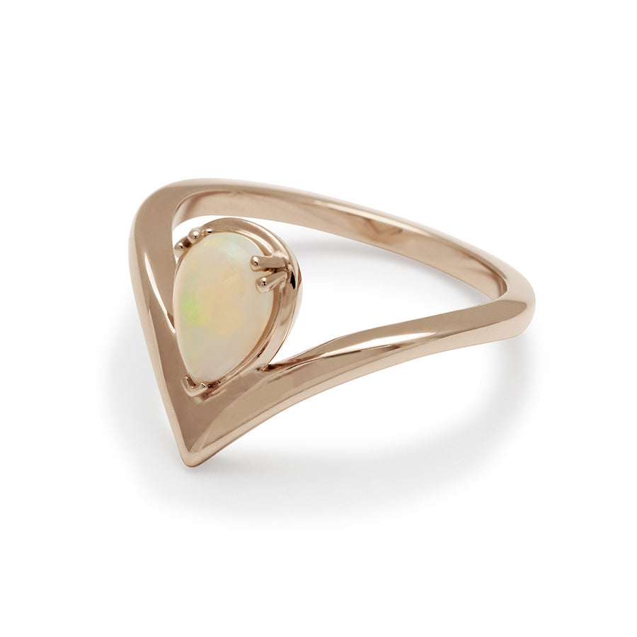 Angled view of a pear shaped ring with an opal center stone set in rose gold., Rose Gold