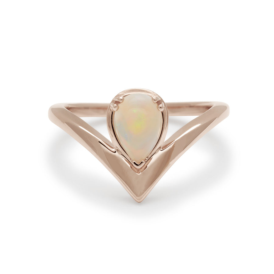 A pear shaped ring with an opal center stone set in rose gold., Rose Gold