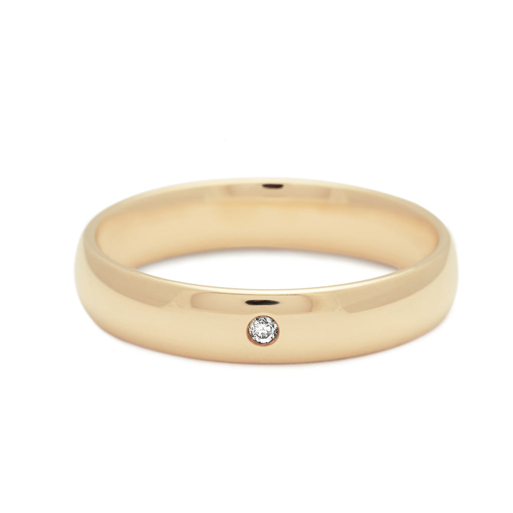 A 4mm classic round band with white diamond accent stone set in yellow gold., Yellow Gold