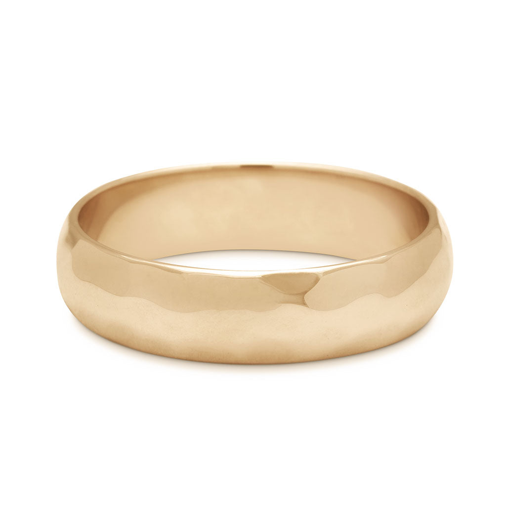 A 5mm classic round band with a hammered finish set in yellow gold